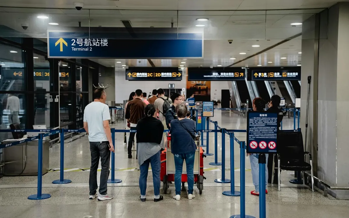 Shanghai airport terminal signs used by visitors checking China entry and transit details