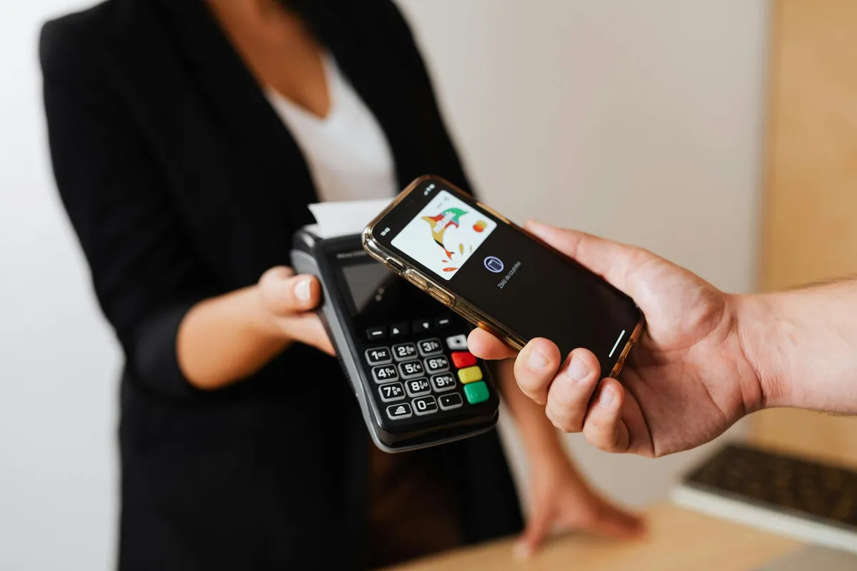 Traveler using a phone payment method before preparing backup options for China
