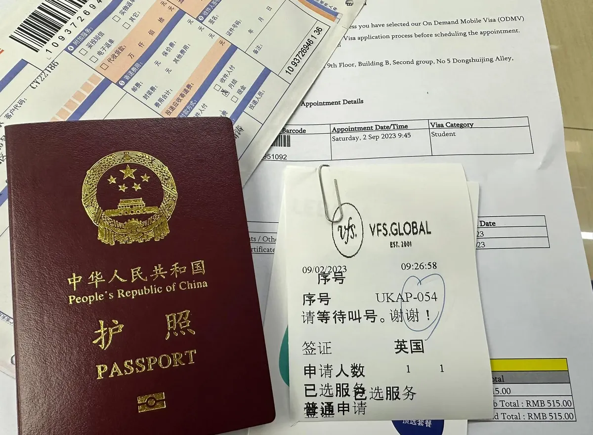 Passport, visa application documents, and appointment papers prepared before a China trip