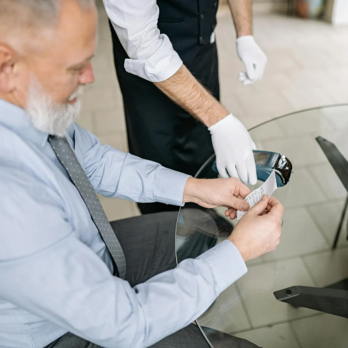 Traveler keeping a receipt as backup for payment records during a China trip