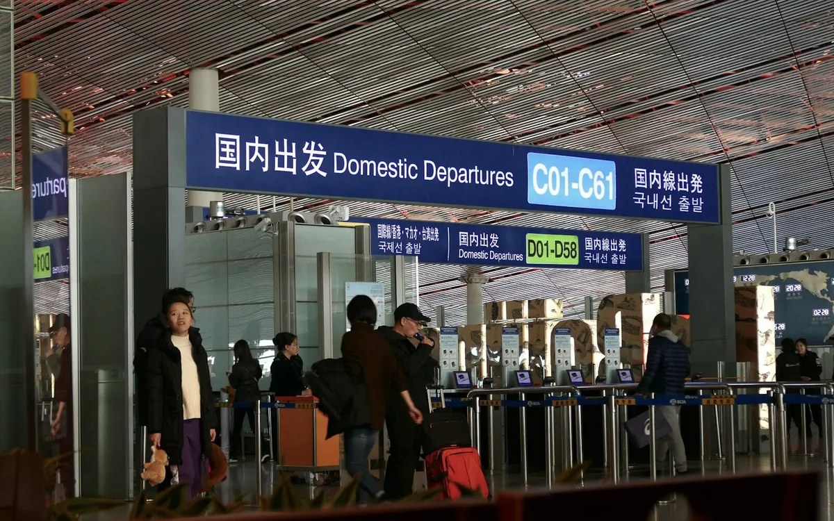 Airport port signs where travelers confirm entry and transit details for China