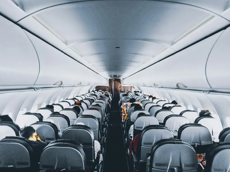 Aircraft cabin representing long-haul route planning before arriving in China