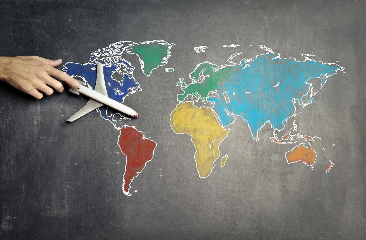 Traveler planning an international route map before choosing a China arrival airport