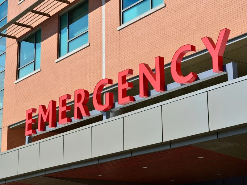 Hospital emergency sign showing why travelers should prepare help contacts before a China trip