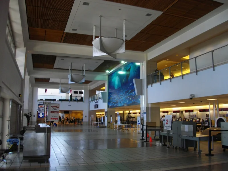 Airport ticket counters where travelers confirm departure details