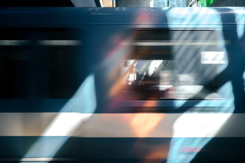 Passing subway train showing why transport connections need buffer time