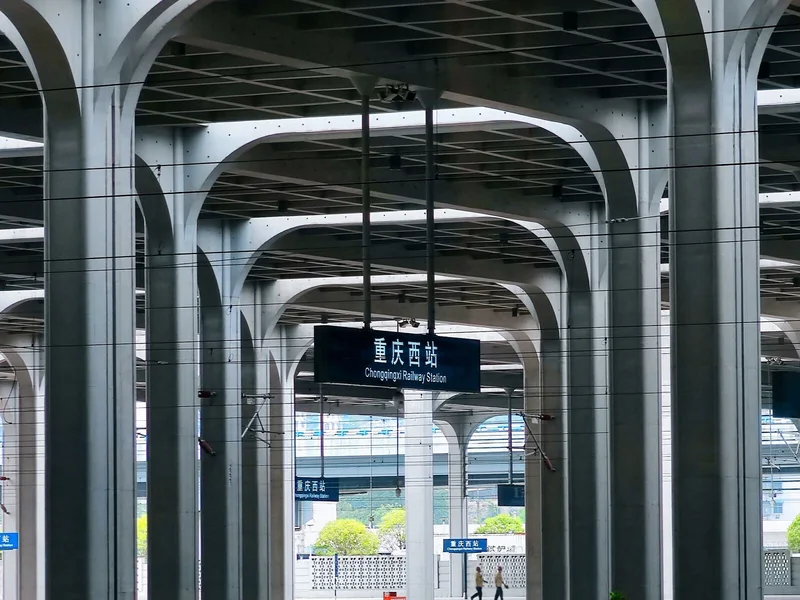 China railway station platform area where travelers need to manage bags and boarding time