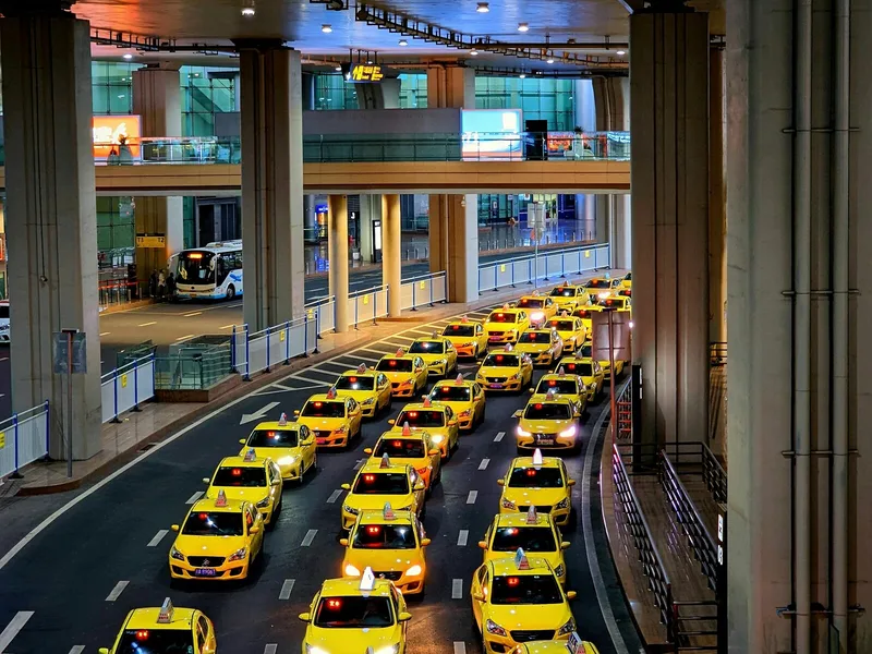 Taxi queue at a transport hub showing airport and station pickup planning in China