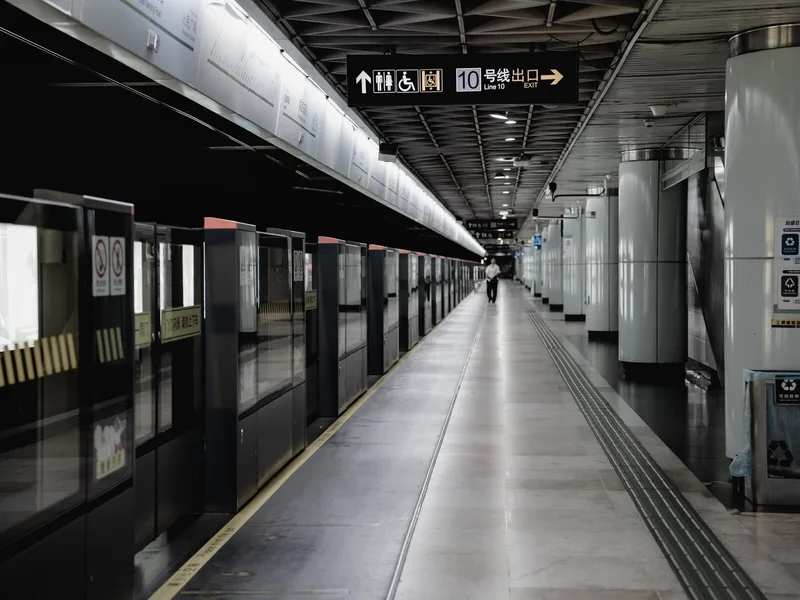 Metro station platform in China where travelers may need clear signs, ticket details, and translation notes