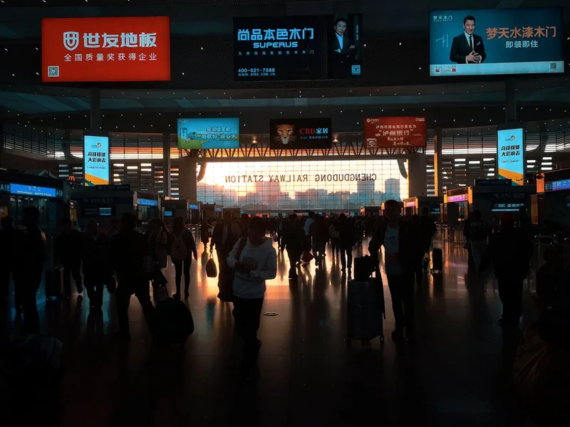 Railway station platform where travelers should plan extra time for walking, gates, and rest breaks